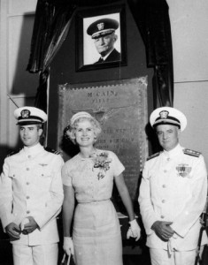 A young John McCain with his parents, under a monument to his grandfather.